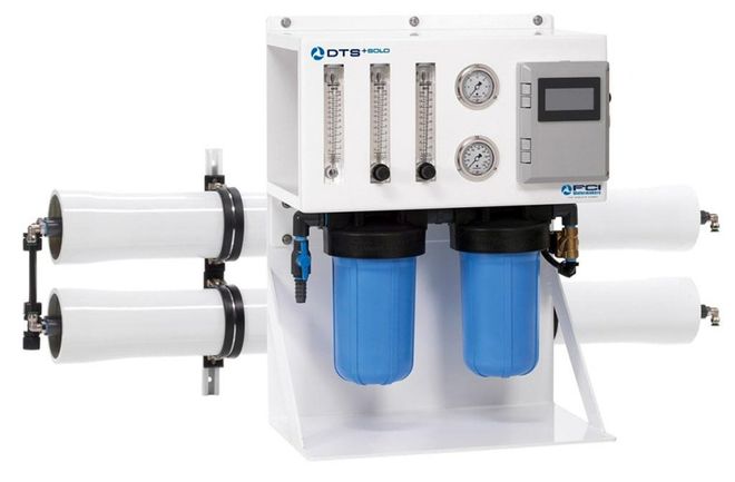 White water filtration system with blue filter canisters and control panel connected to four horizontal filter cartridges