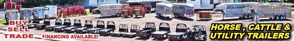 A blurred image of horse cattle utility trailers