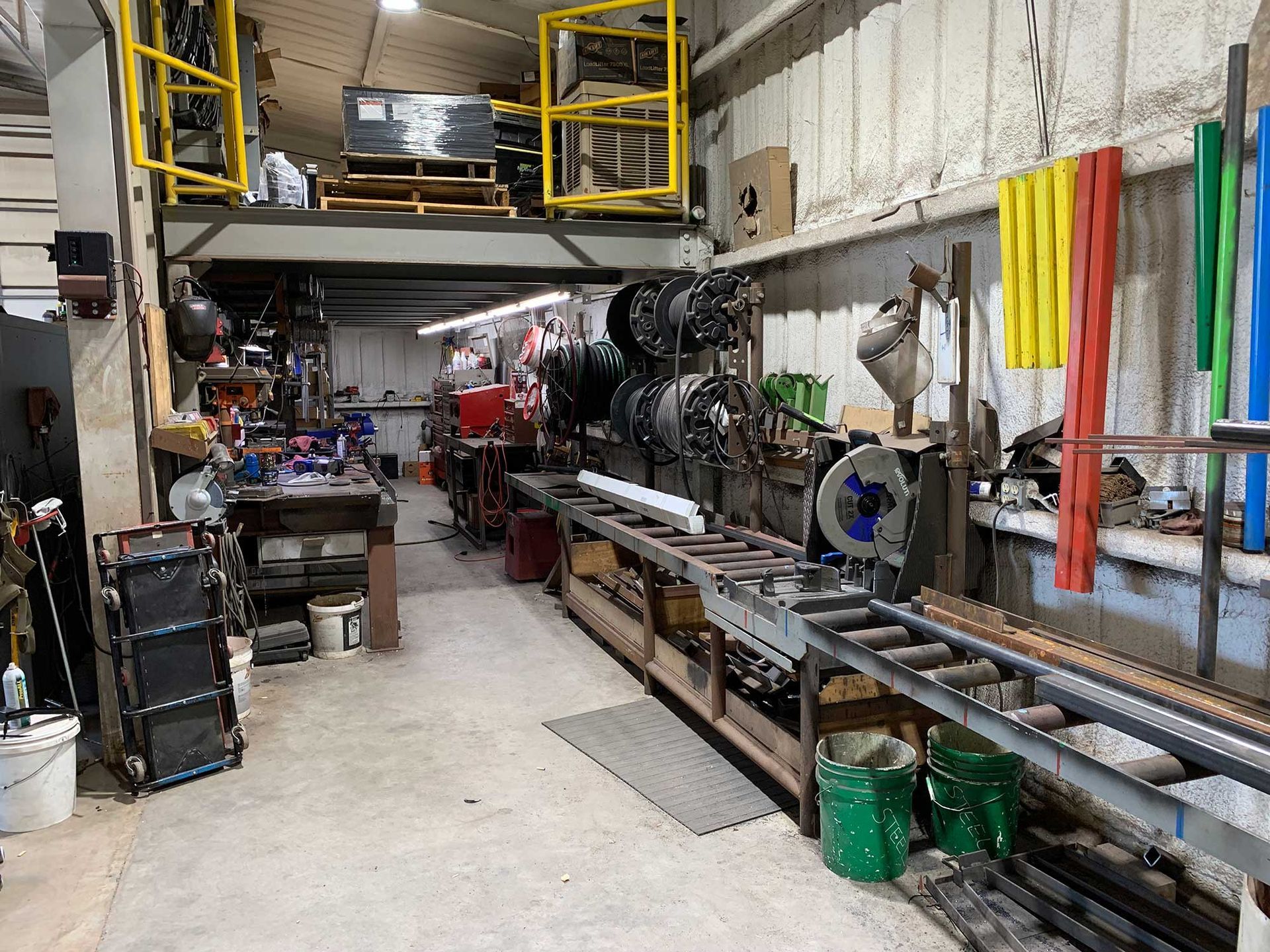 A warehouse filled with lots of machinery and tools.