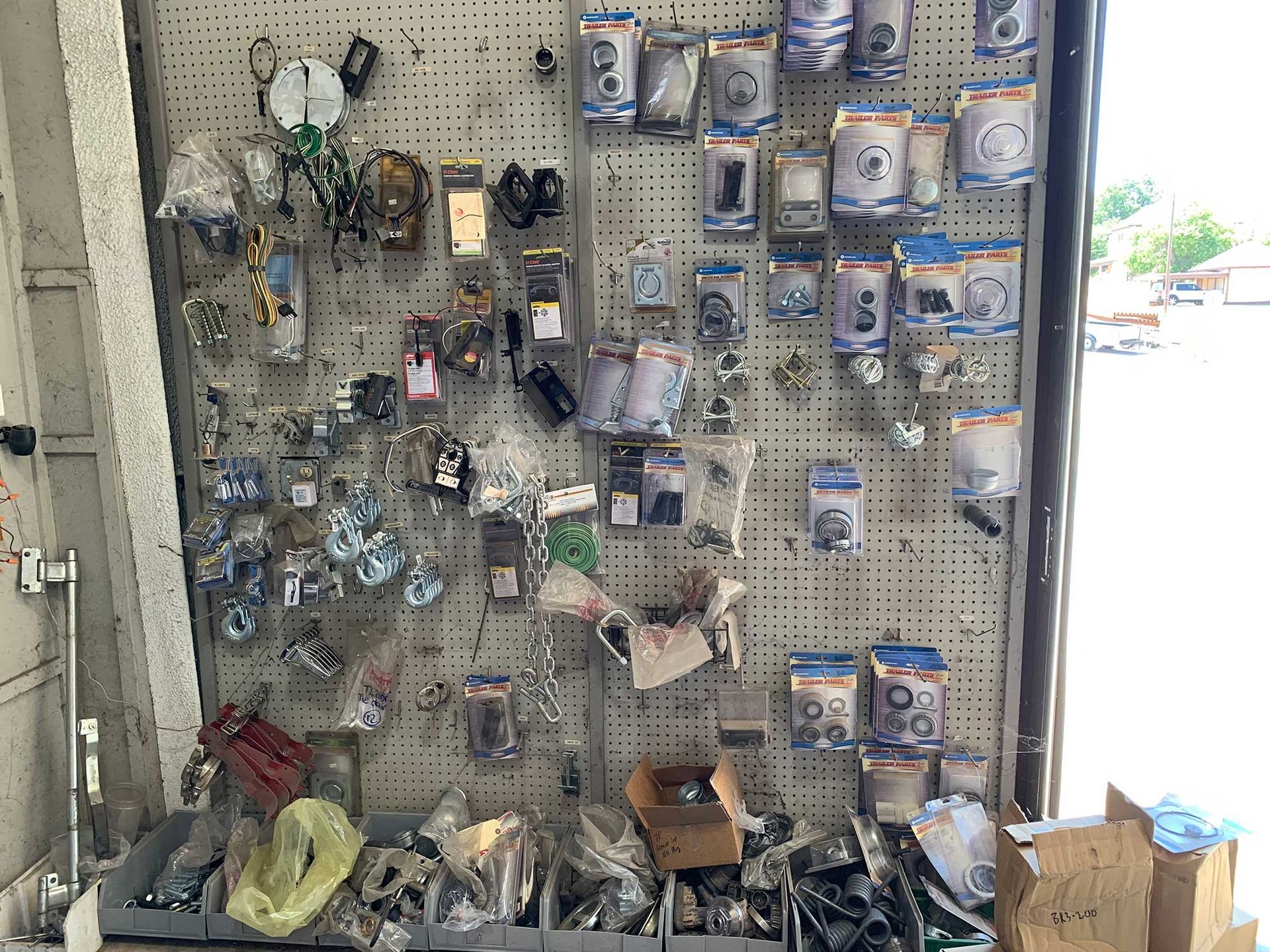 A wall filled with lots of different types of hardware and tools.