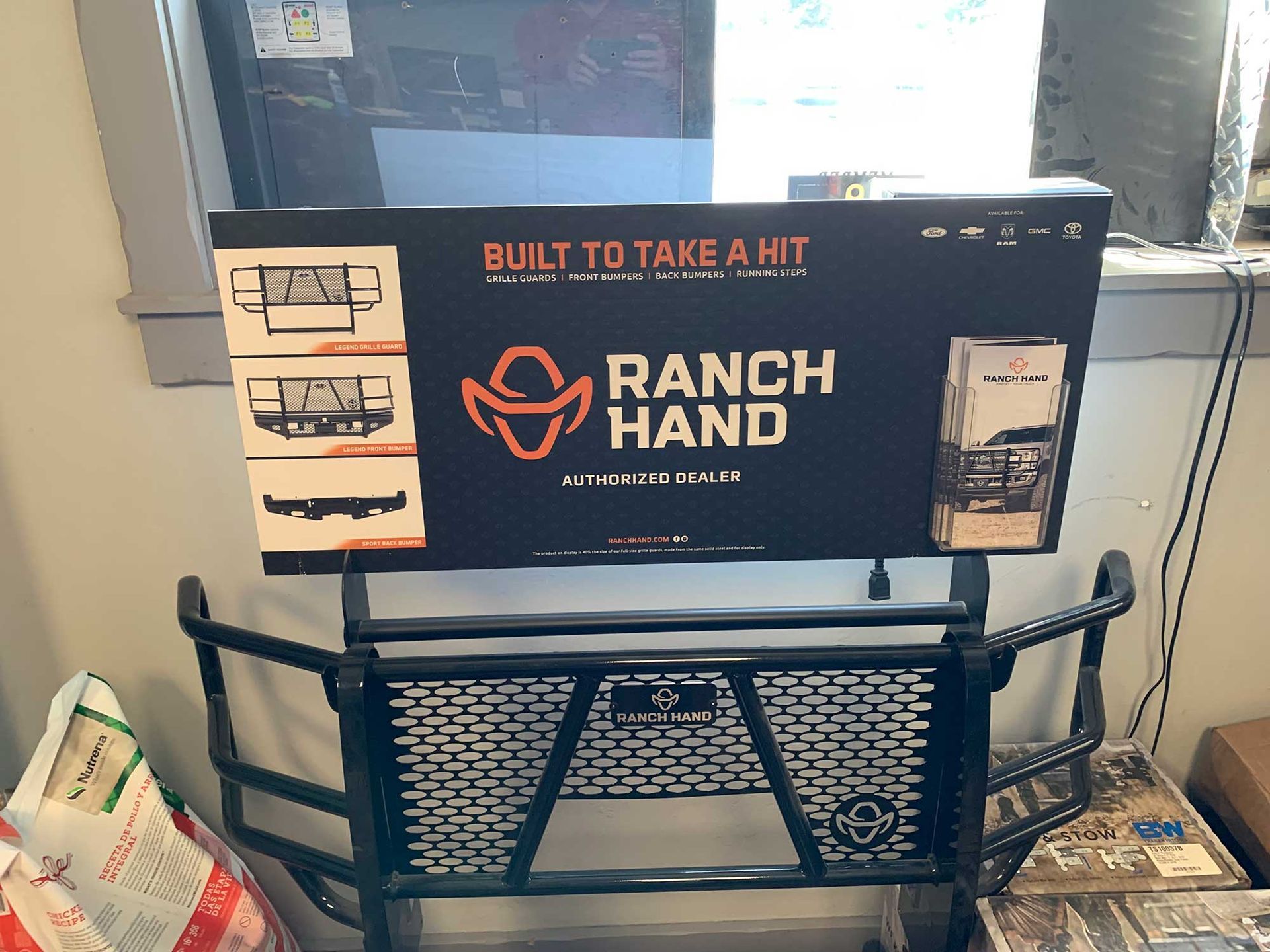 A sign that says ranch hand built to take a hit