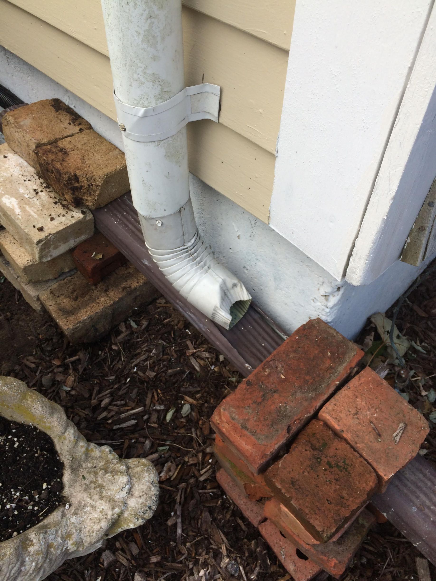 a white pipe on a house