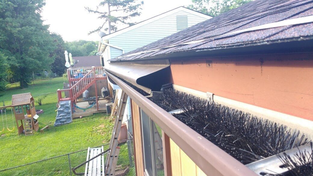 a house with a gutter and a ladder