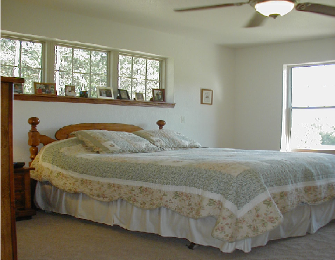 Wooden bed with clean mattress