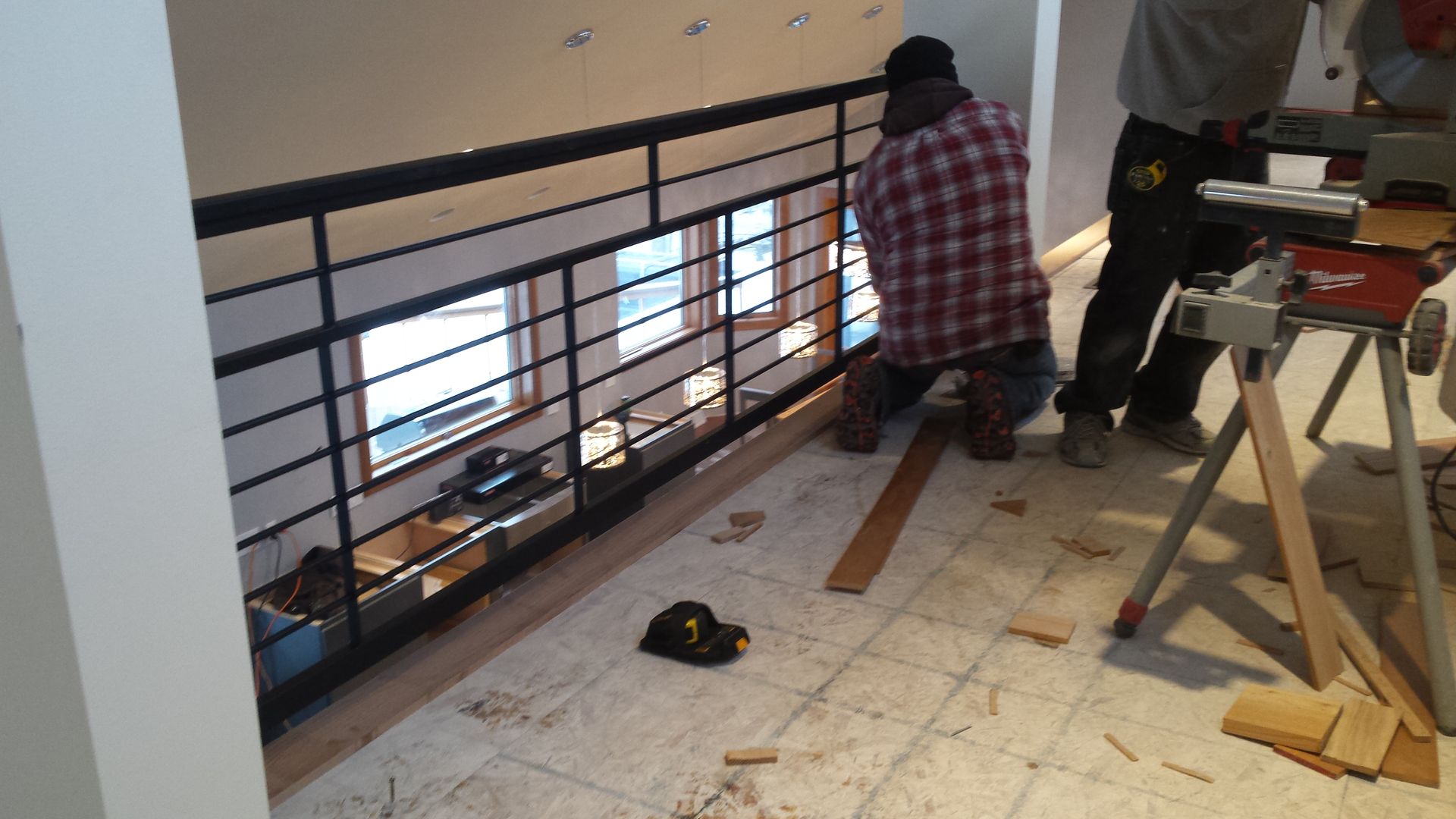 Man installing metal railing