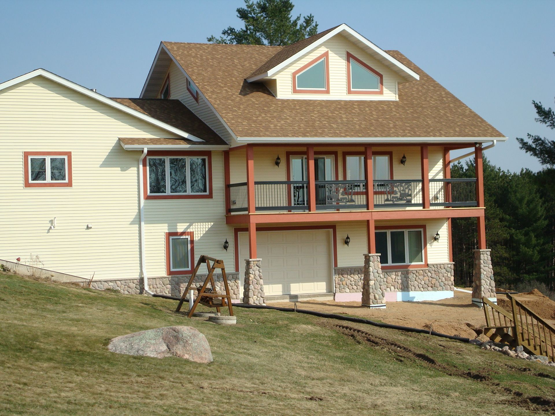House with siding and pillars