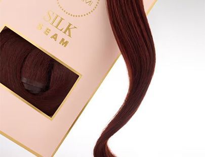 A close-up of a box of silk cream hair extensions