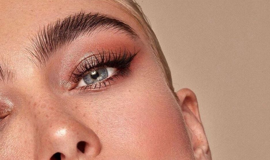 A close-up of a woman's face with nice eyebrows and lashes.