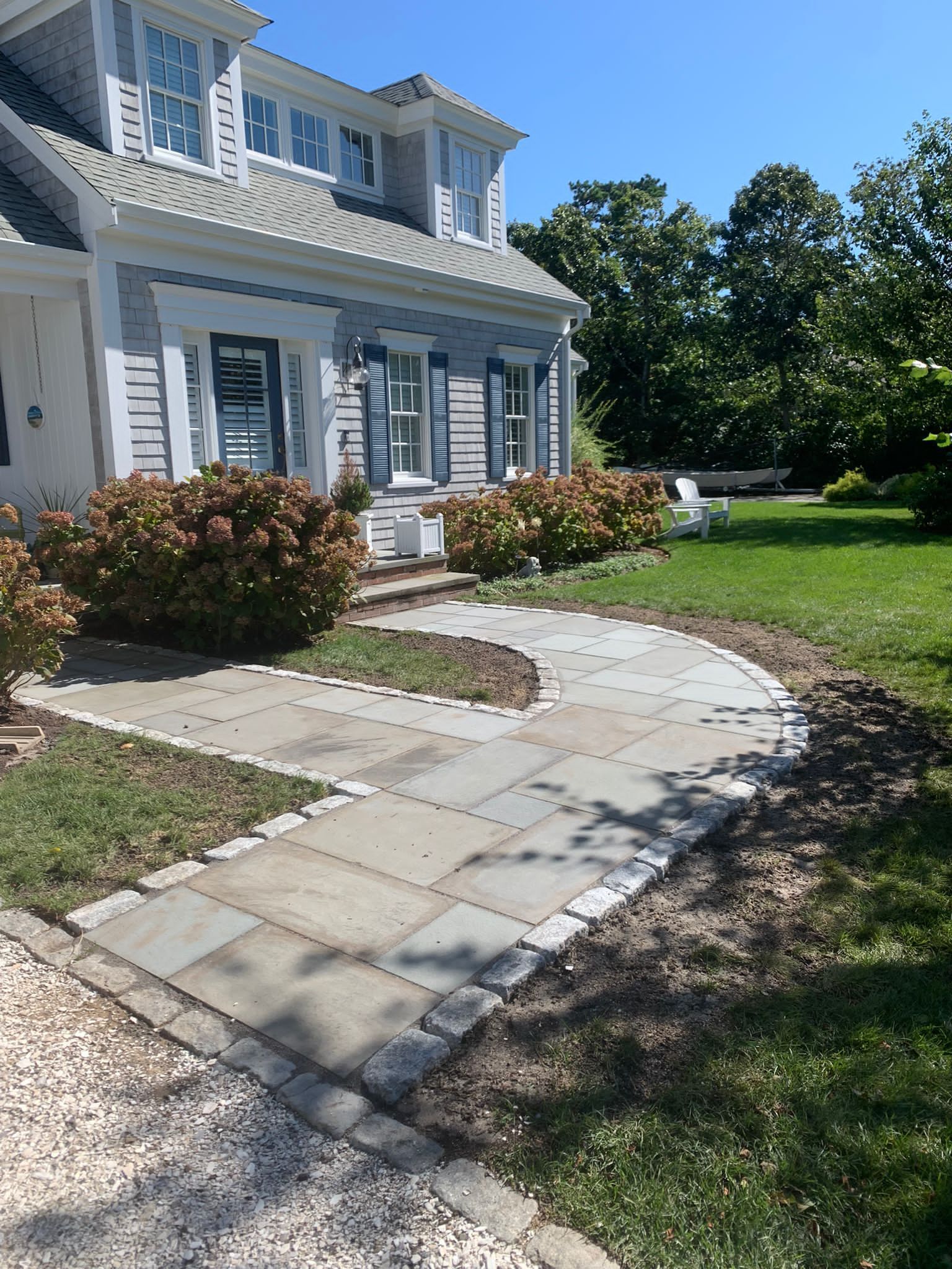 Walkway leading to the front of the house