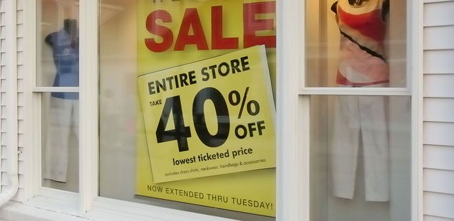 Storefront sale sign: “ENTIRE STORE 40% OFF” in red, black, and yellow