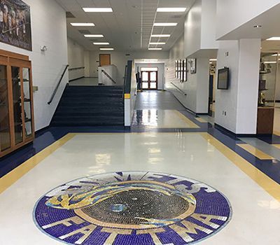 A hallway with a tiger logo on the floor