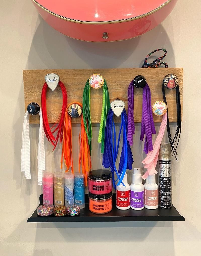A shelf with a bunch of hair products on it