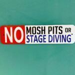 A sign that says no mosh pits or stage diving on a blue background.