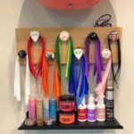 A shelf with a bunch of hair products on it.