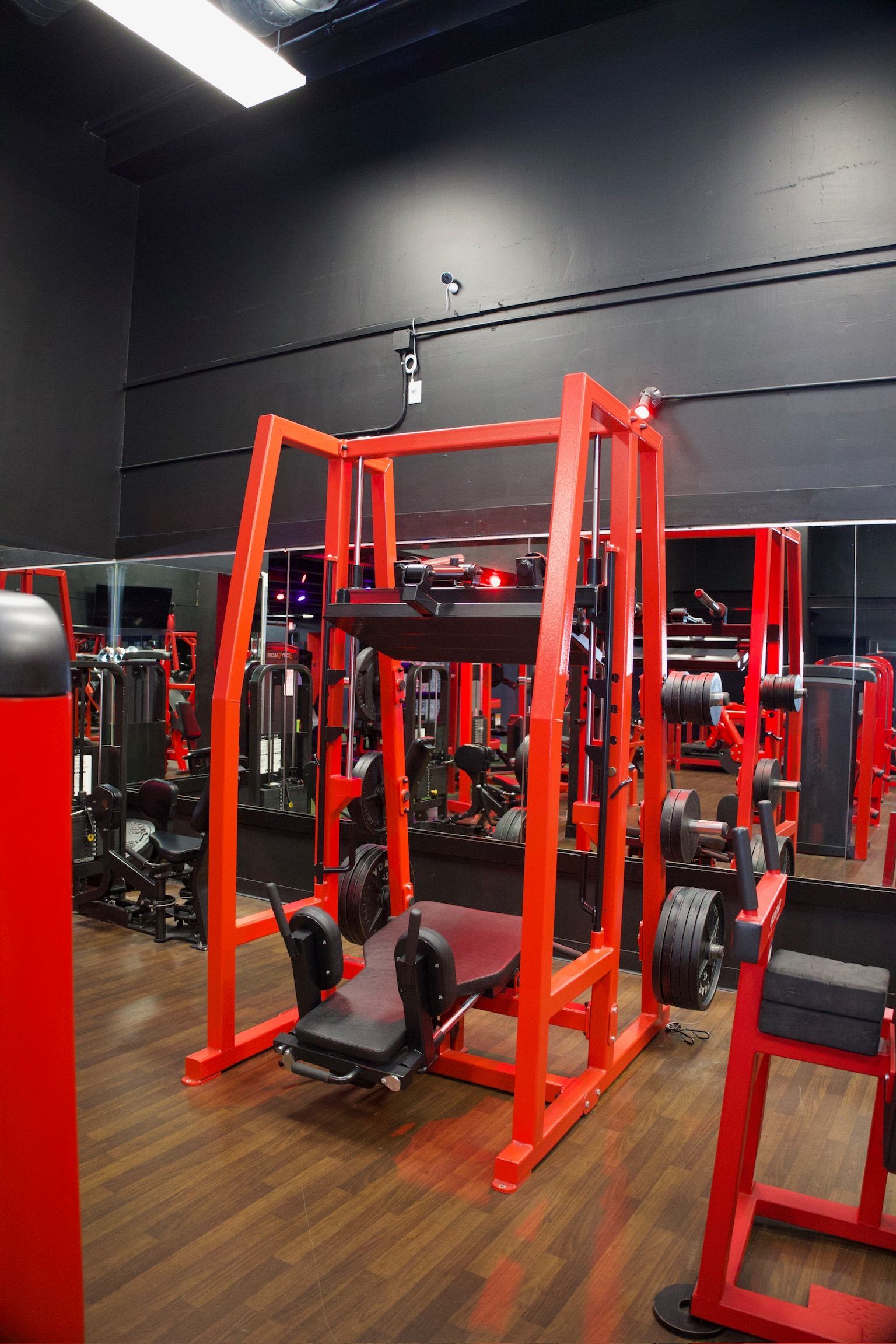 Red weight machine in a gym.