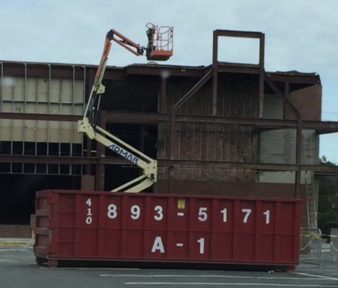 red dumpster with crane