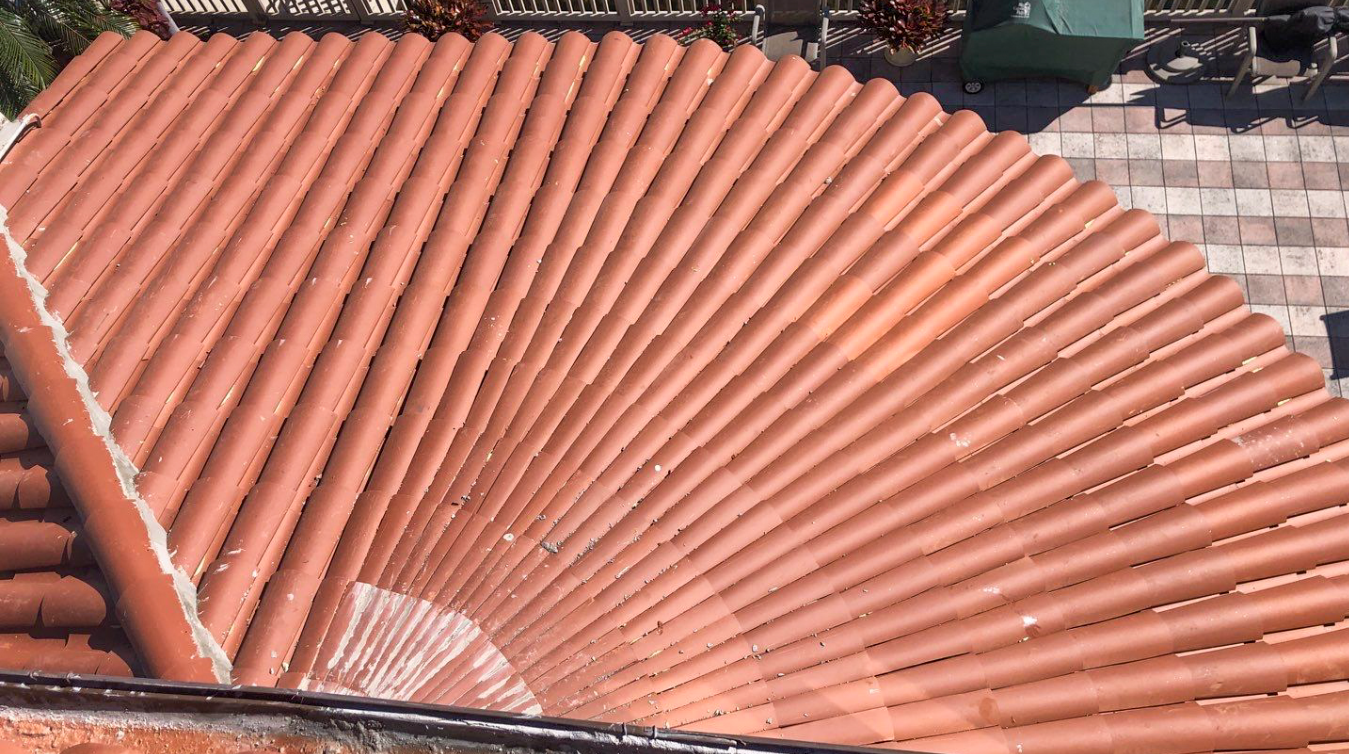 A close up of a red tile roof that looks like an accordion