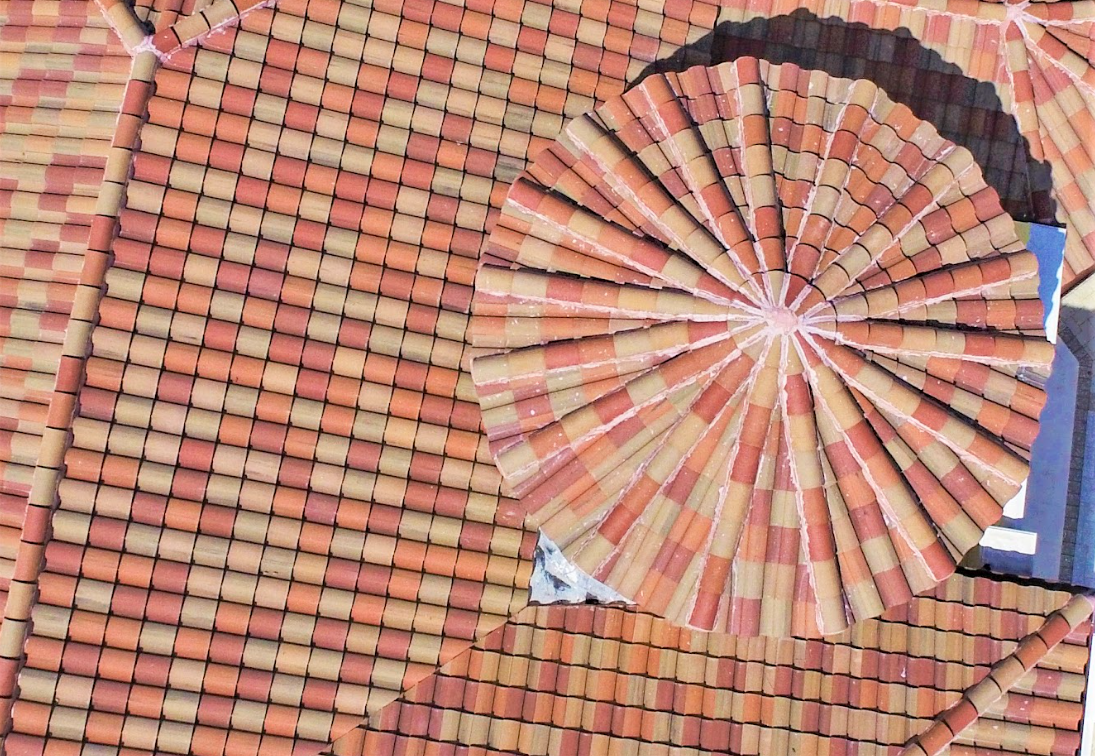 A circular pattern of bricks on a roof