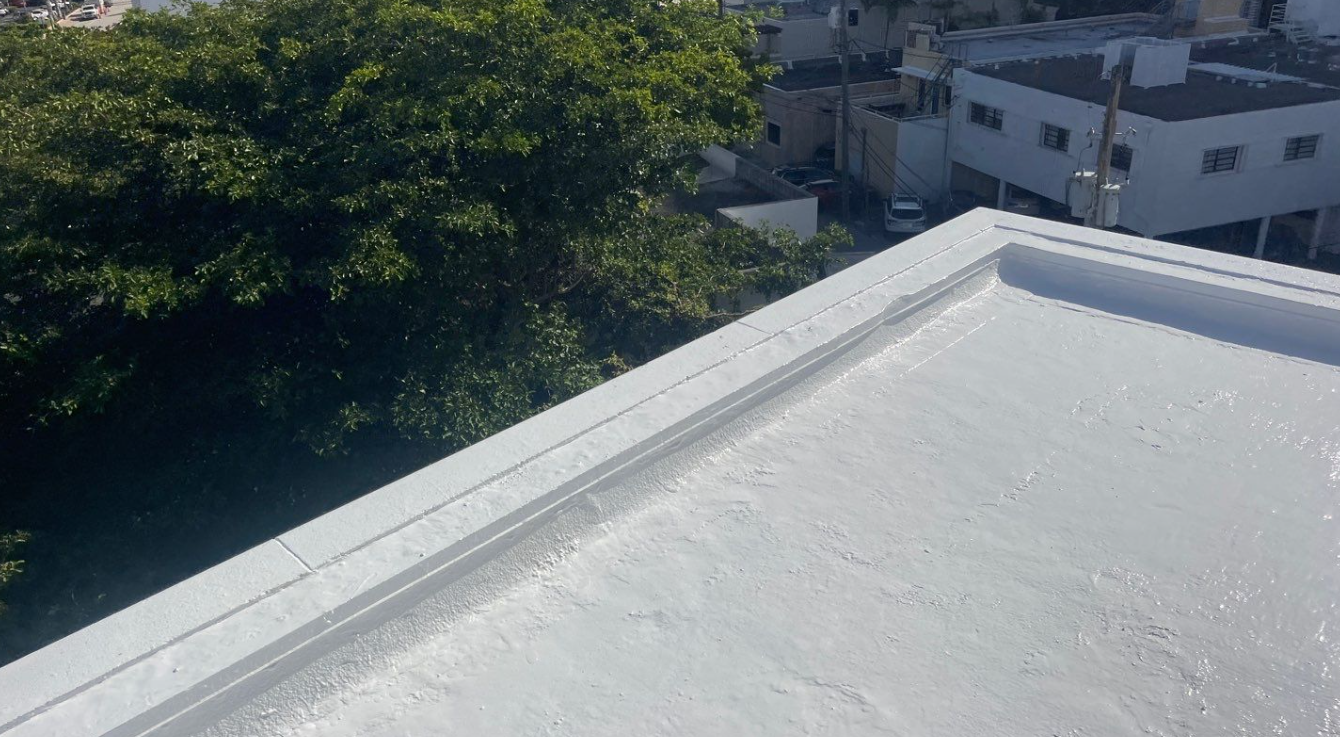 A white roof with a view of a city and trees