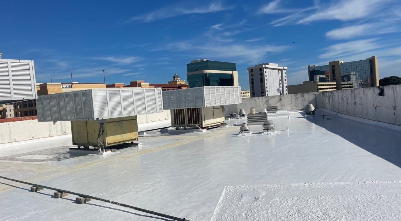A white roof with a lot of buildings in the background