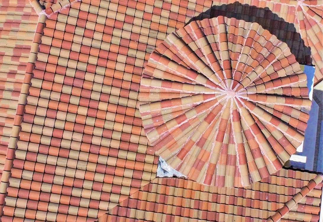 A circular pattern of bricks on a roof