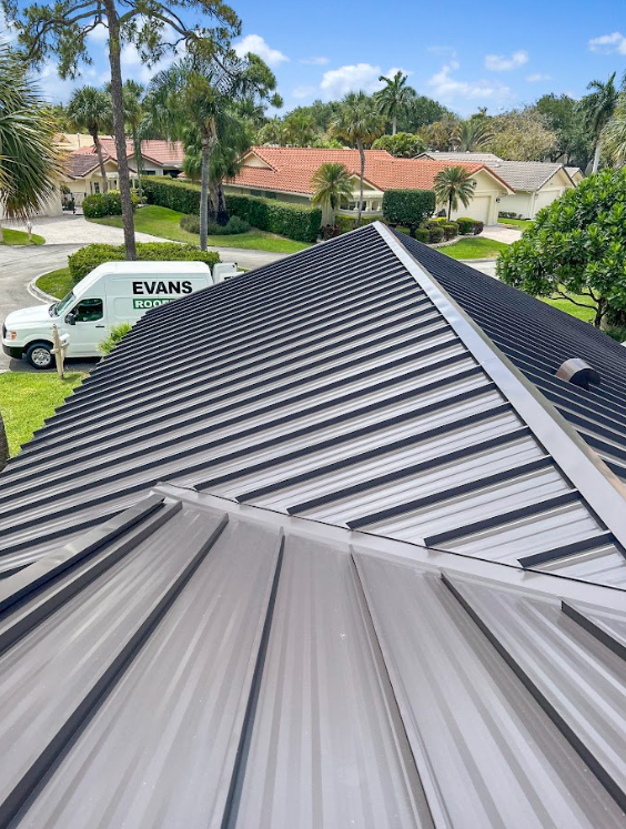 A white van is parked on the roof of a house