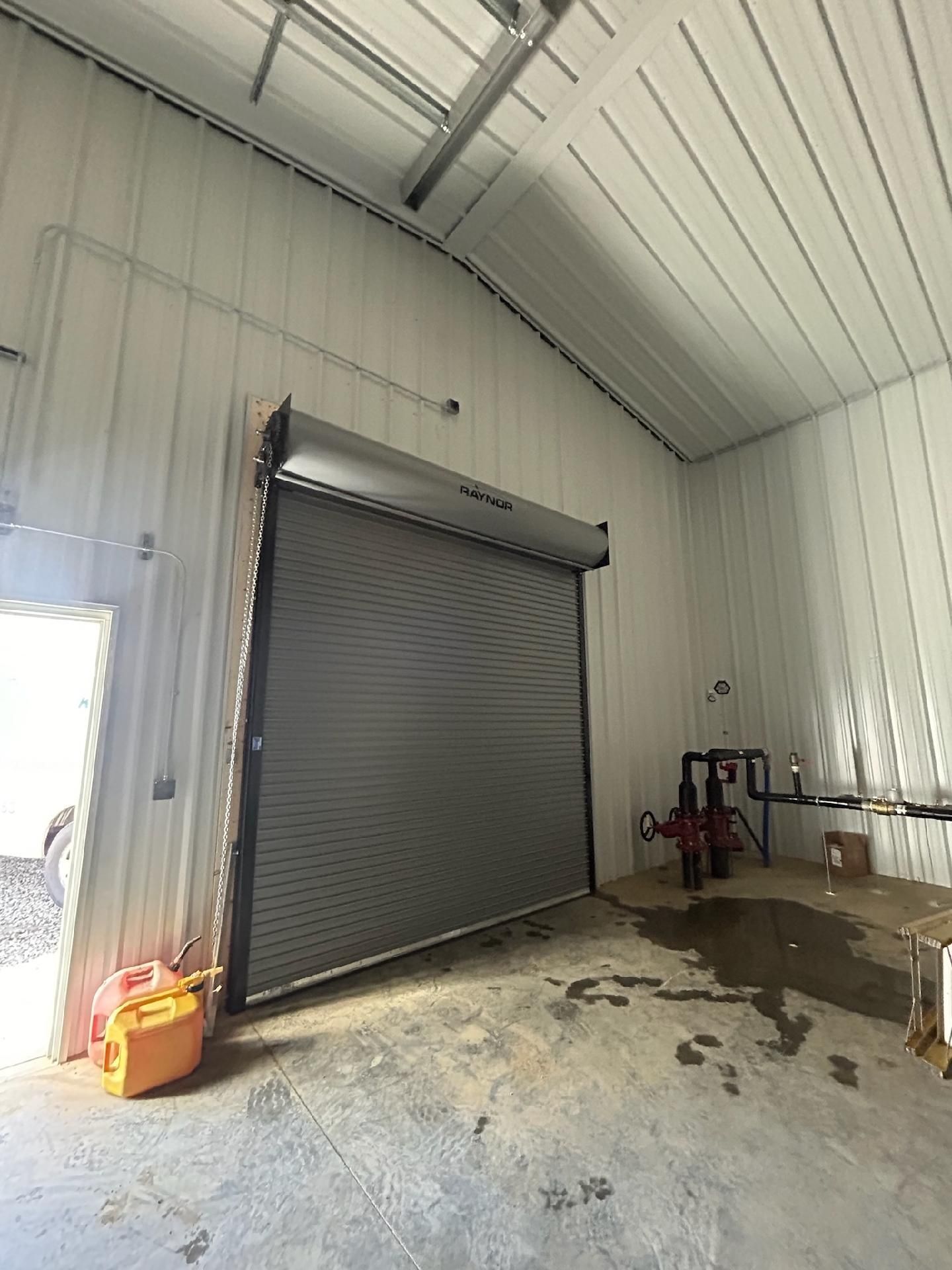 There is a garage door in the middle of the room.