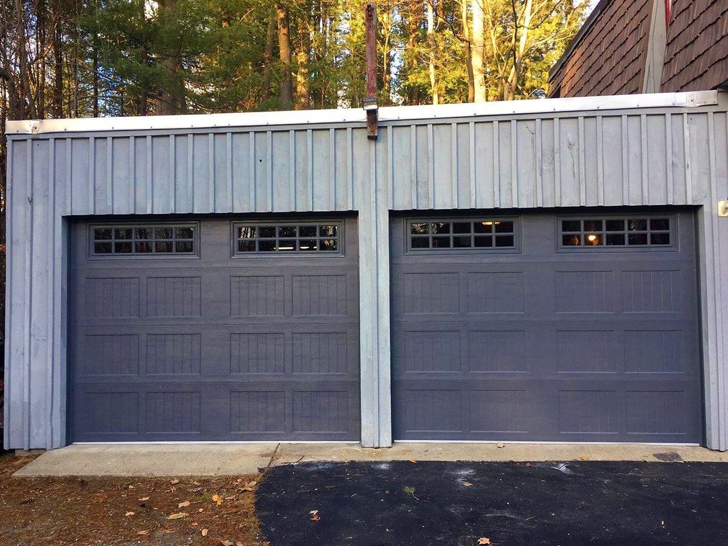 A couple of garage doors are sitting next to each other.