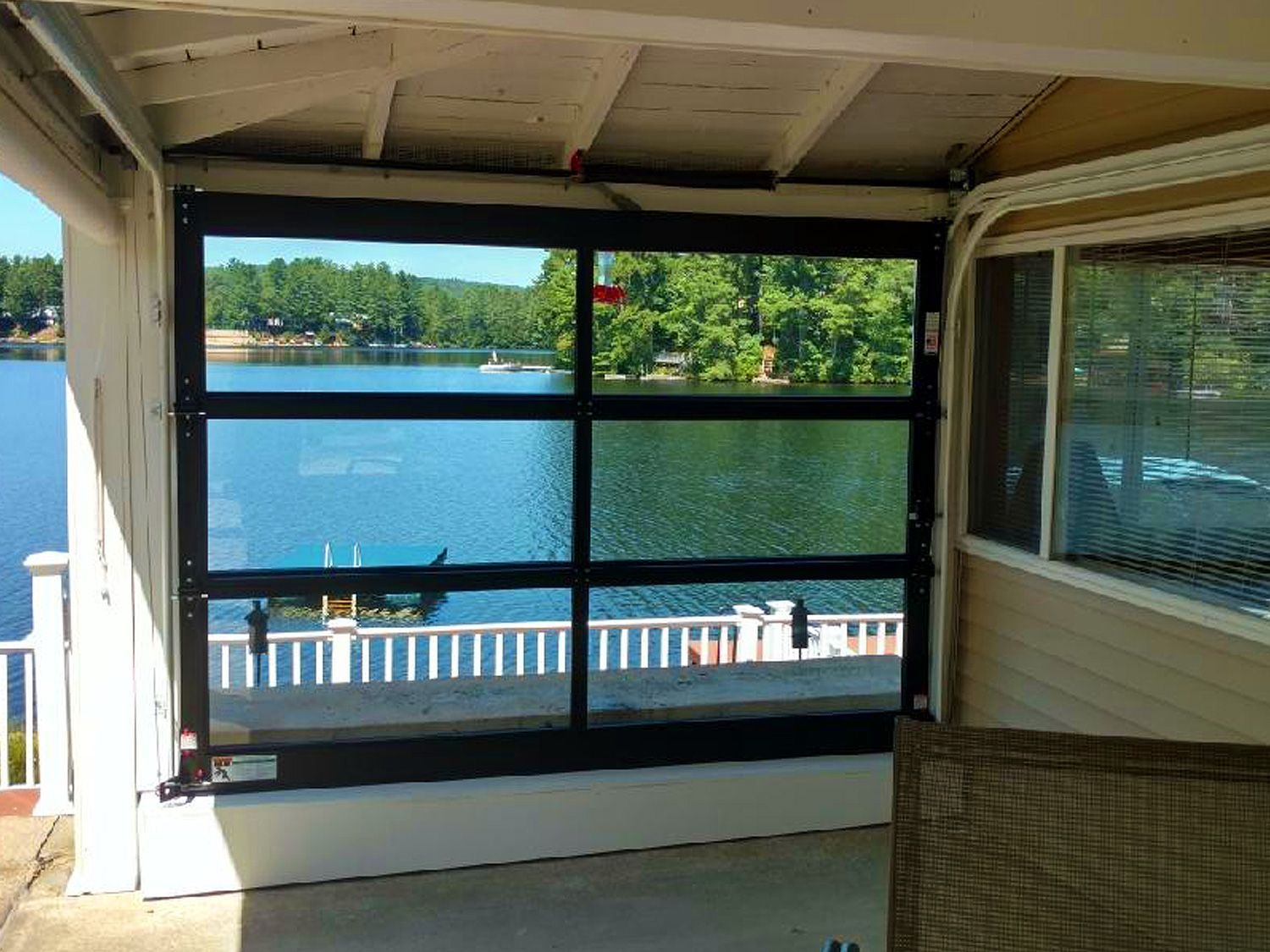 A view of a lake through a garage door.