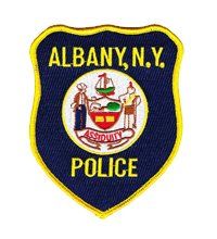 A patch for the albany new york police department on a white background.