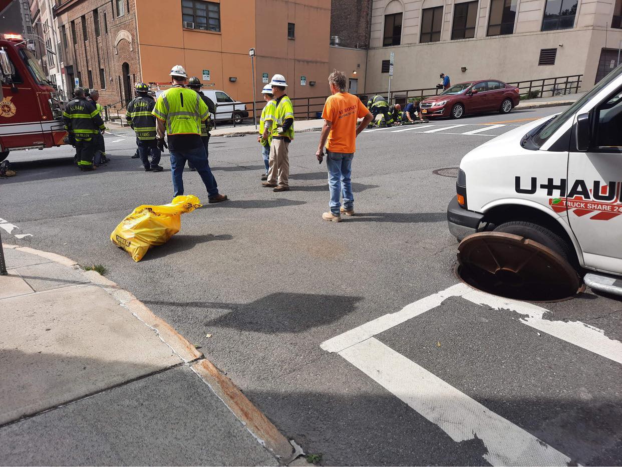 A u-haul van is parked on the side of the road