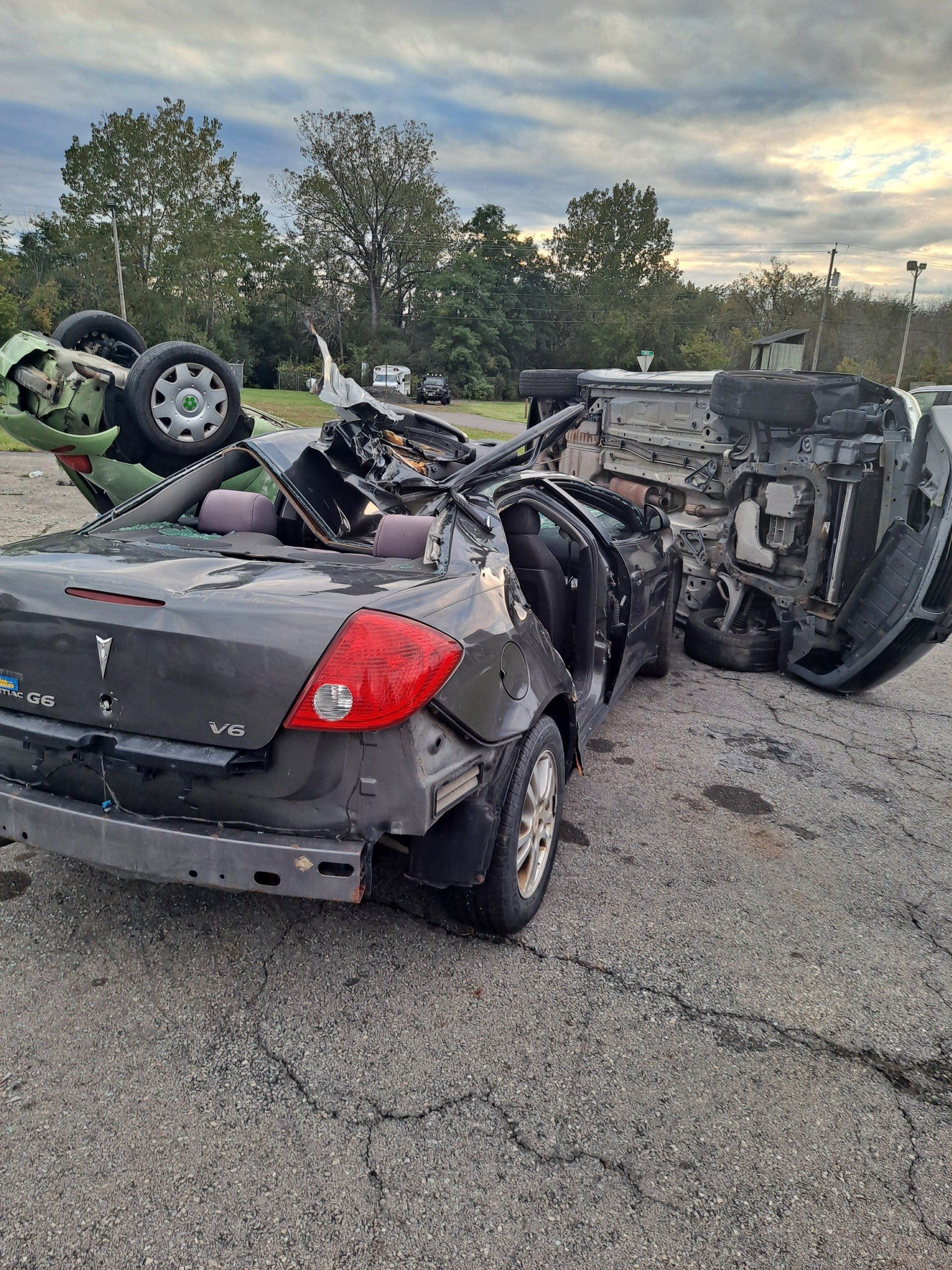 A car has crashed into another car in a parking lot.