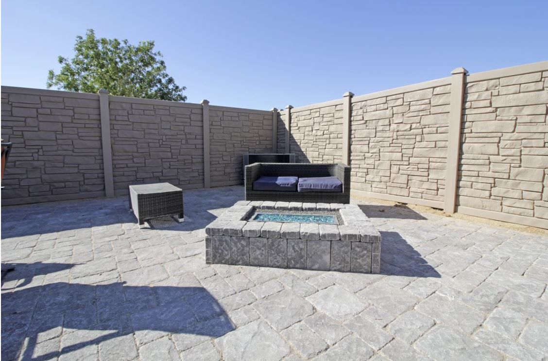 There is a fire pit in the middle of the patio.