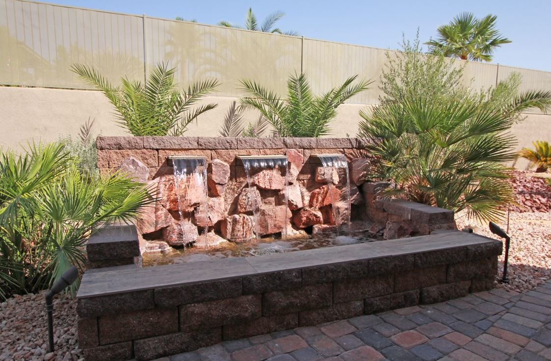 There is a waterfall in the middle of the garden.