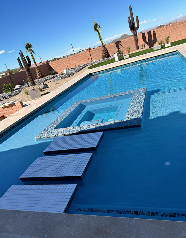 A large swimming pool with a hot tub in the middle