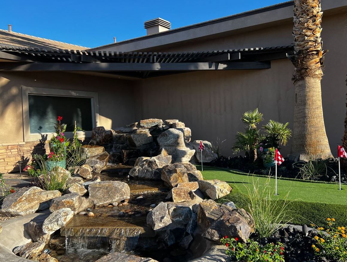 A house with a waterfall in front of it
