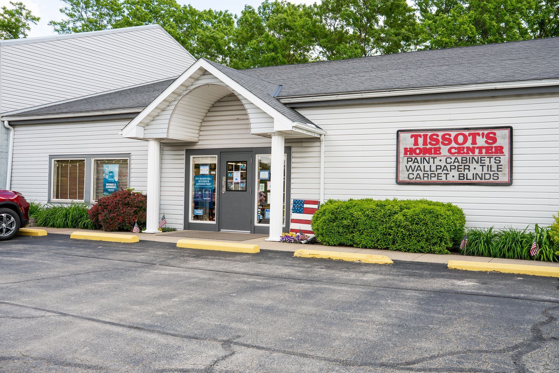 A white building with a sign that says Tissot's Home Center