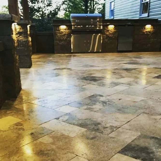 A tiled floor with a grill in the background