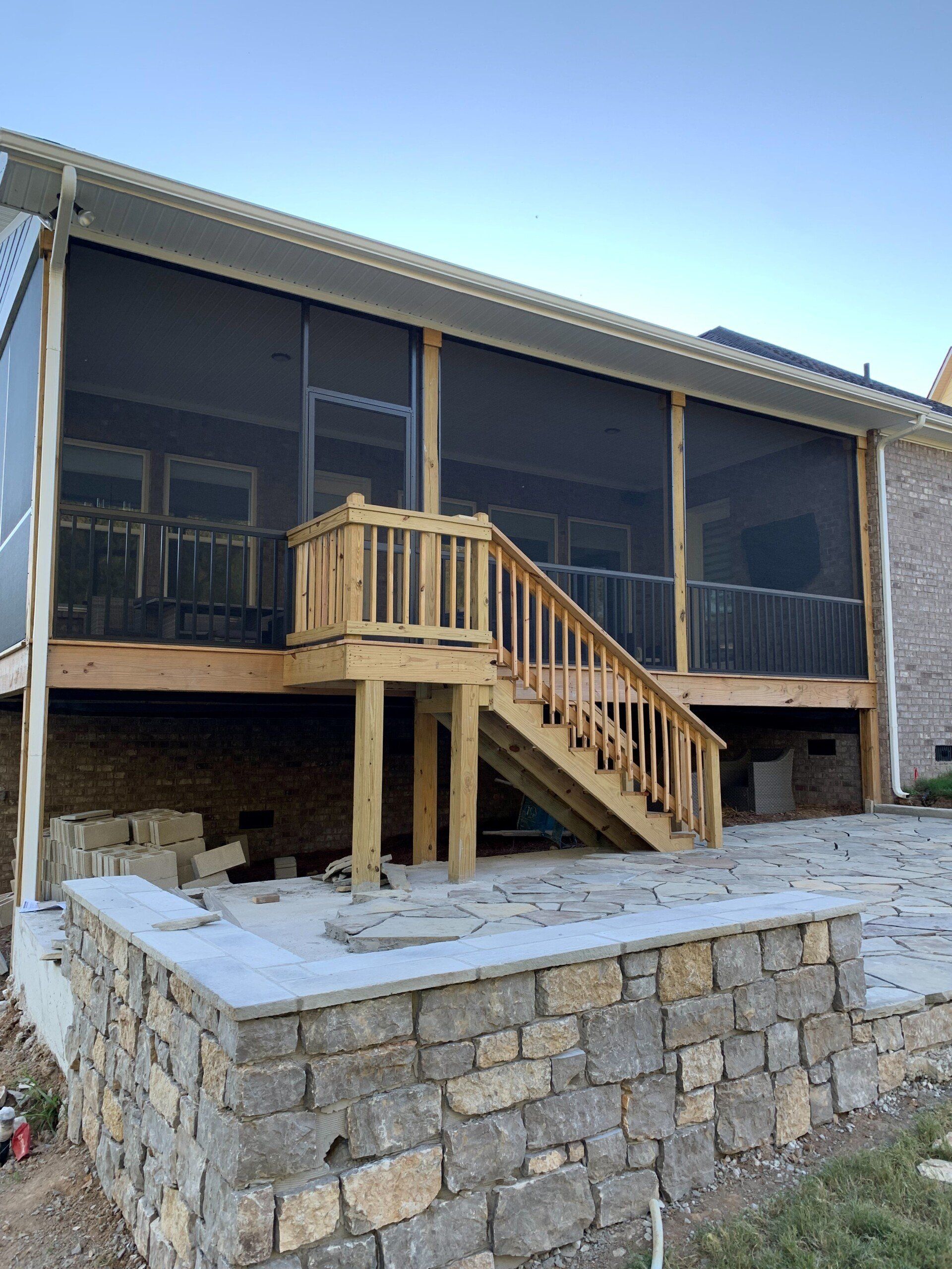 house with brick floor and wood stairs
