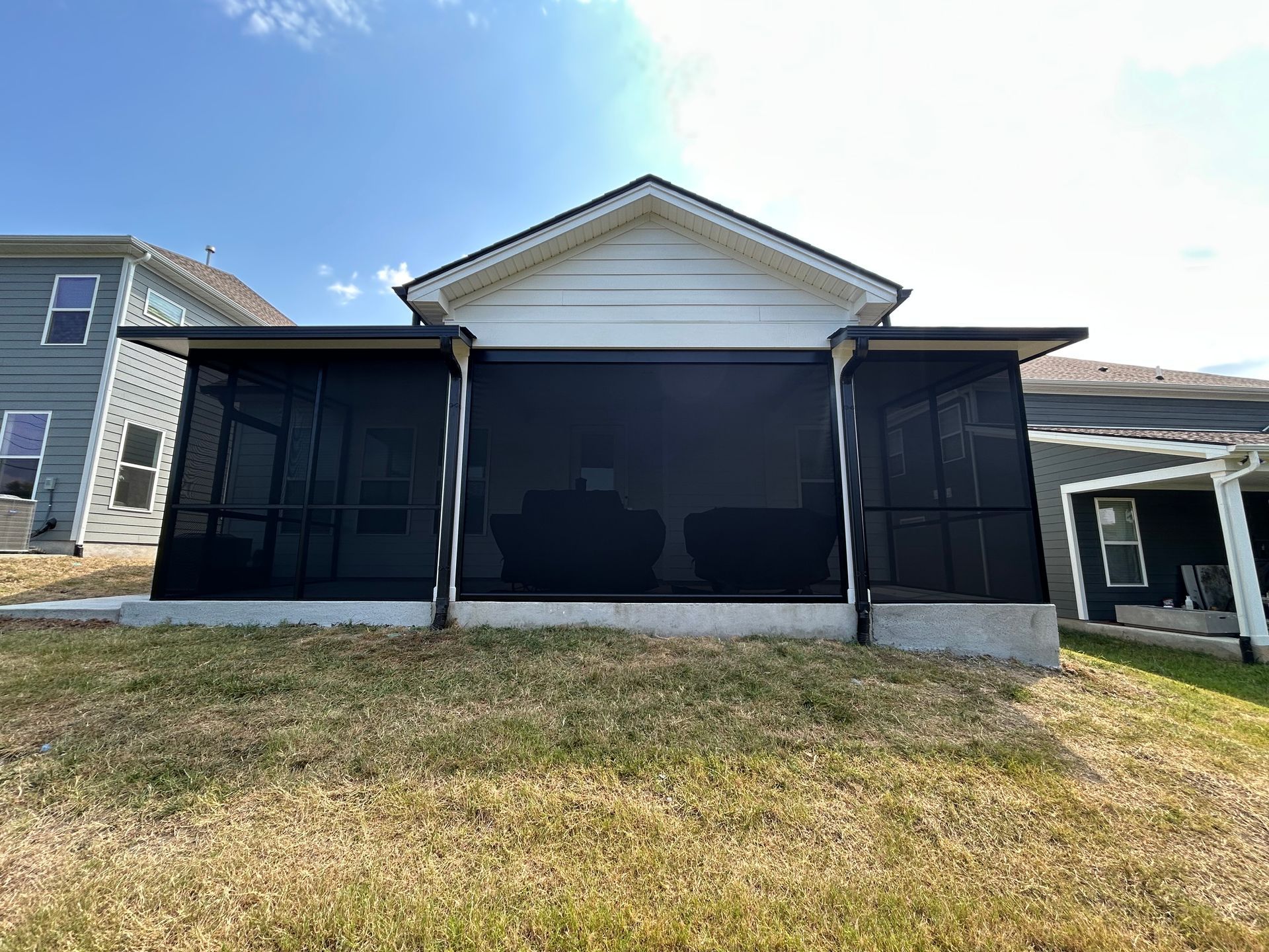Motorized screen on a porch.