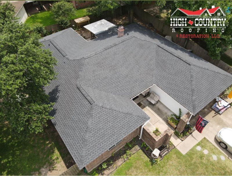 An aerial view of a house with a new roof