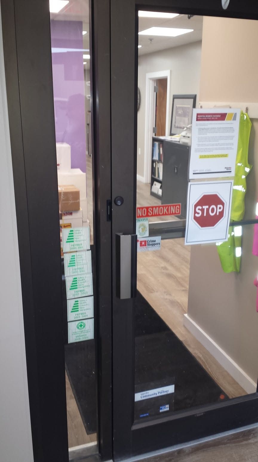 A glass door with a stop sign on it