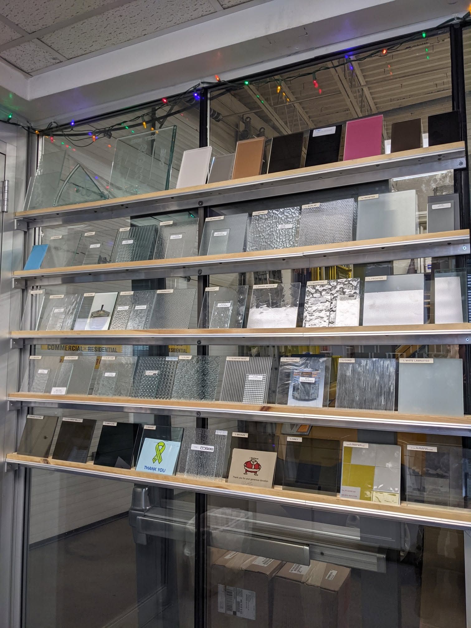 There are many different types of glass on the shelves.