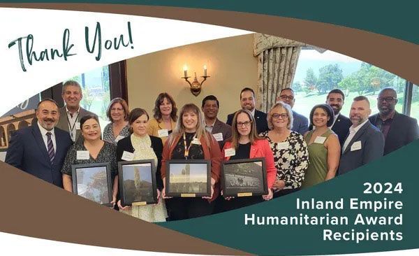 A group of people are posing for a picture and the caption says thank you for the amazing work you all do in the inland empire