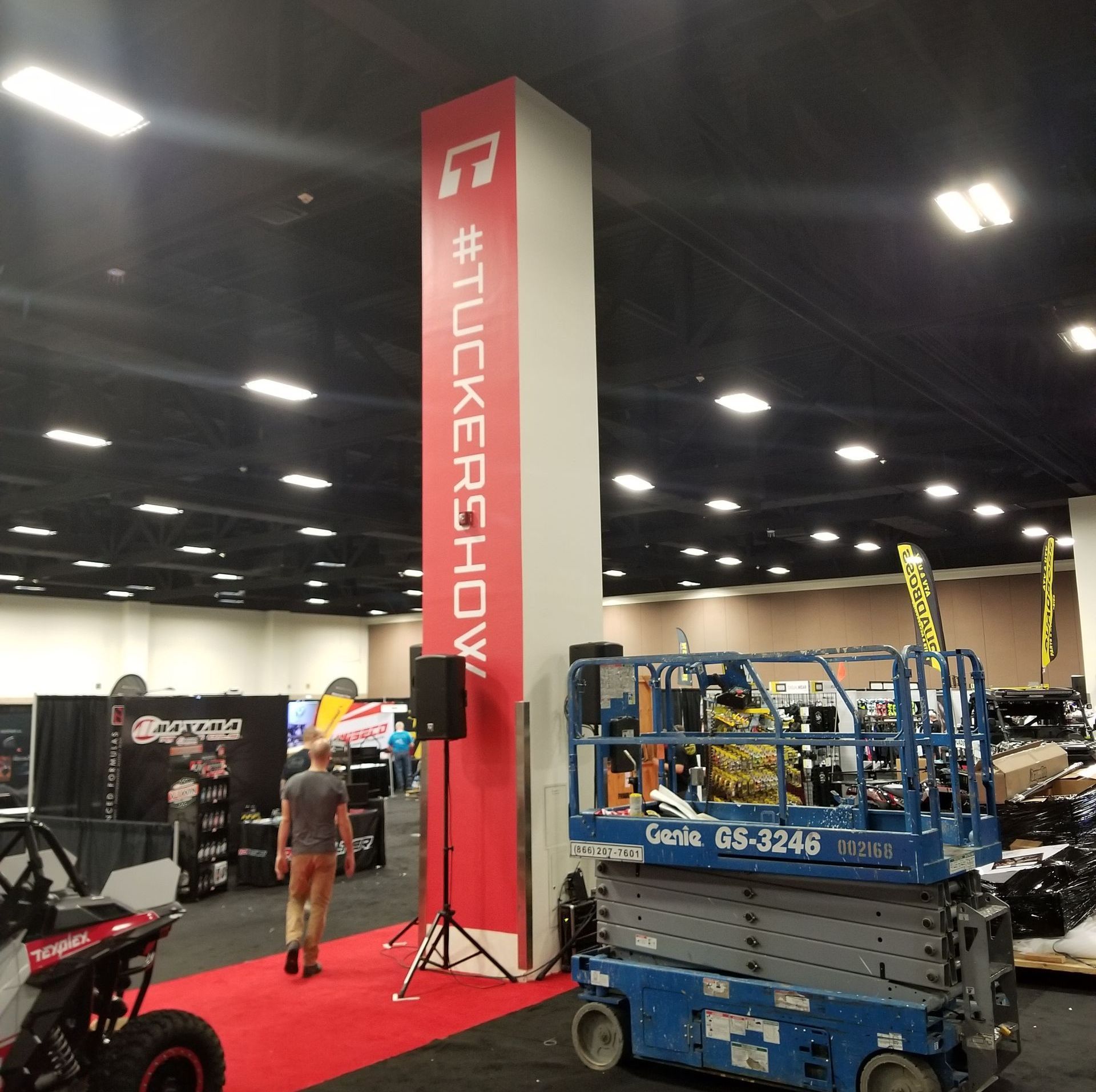 Tall red and white pillar with hashtag 