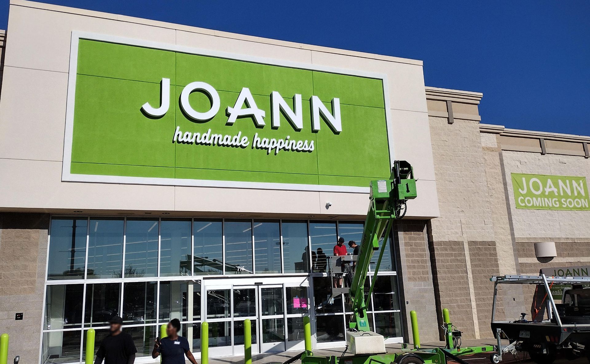 Front-lit channel letter sign being installed for JOANN Fabric and Crafts in Lewisville, TX.