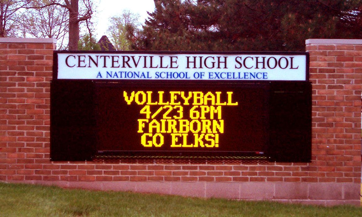 Centerville High School sign advertising volleyball at 4:30 p.m. and Fairborn vs. Elks.