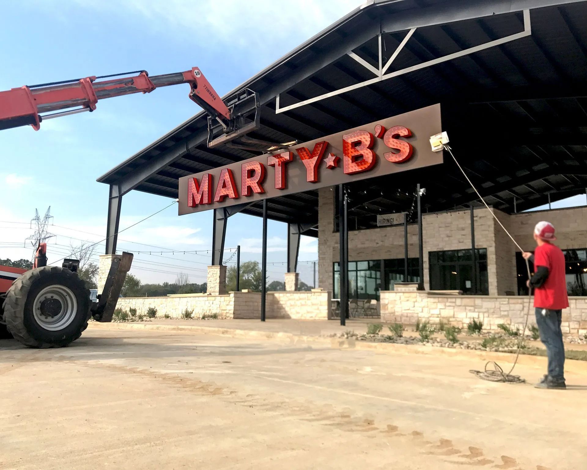 Exposed bulb front-lit channel letter sign for Marty B’s in Bartonville, TX.