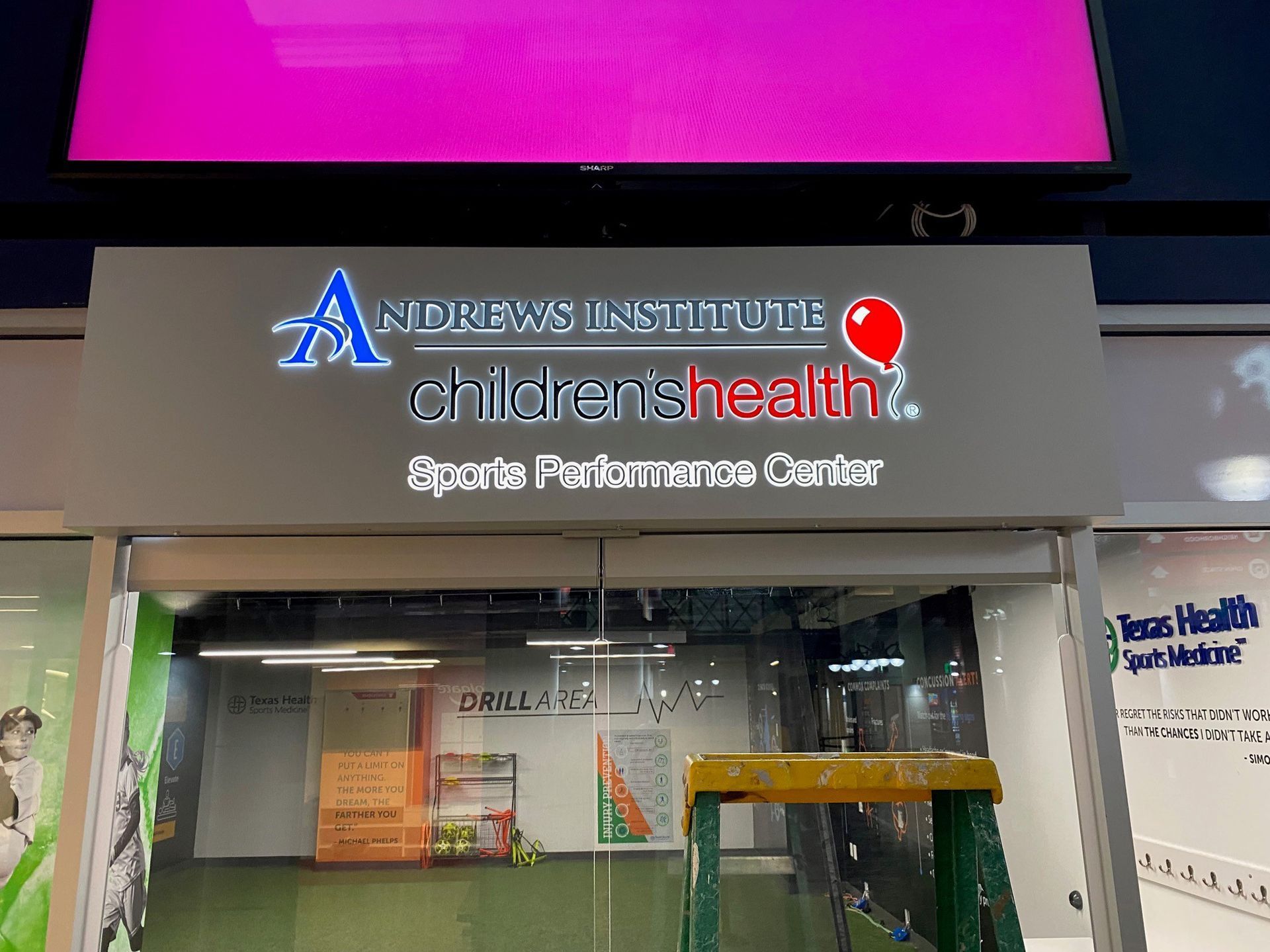 Children’s Health Specialty & Primary Care Center storefront sign with glass entrance and pink awning