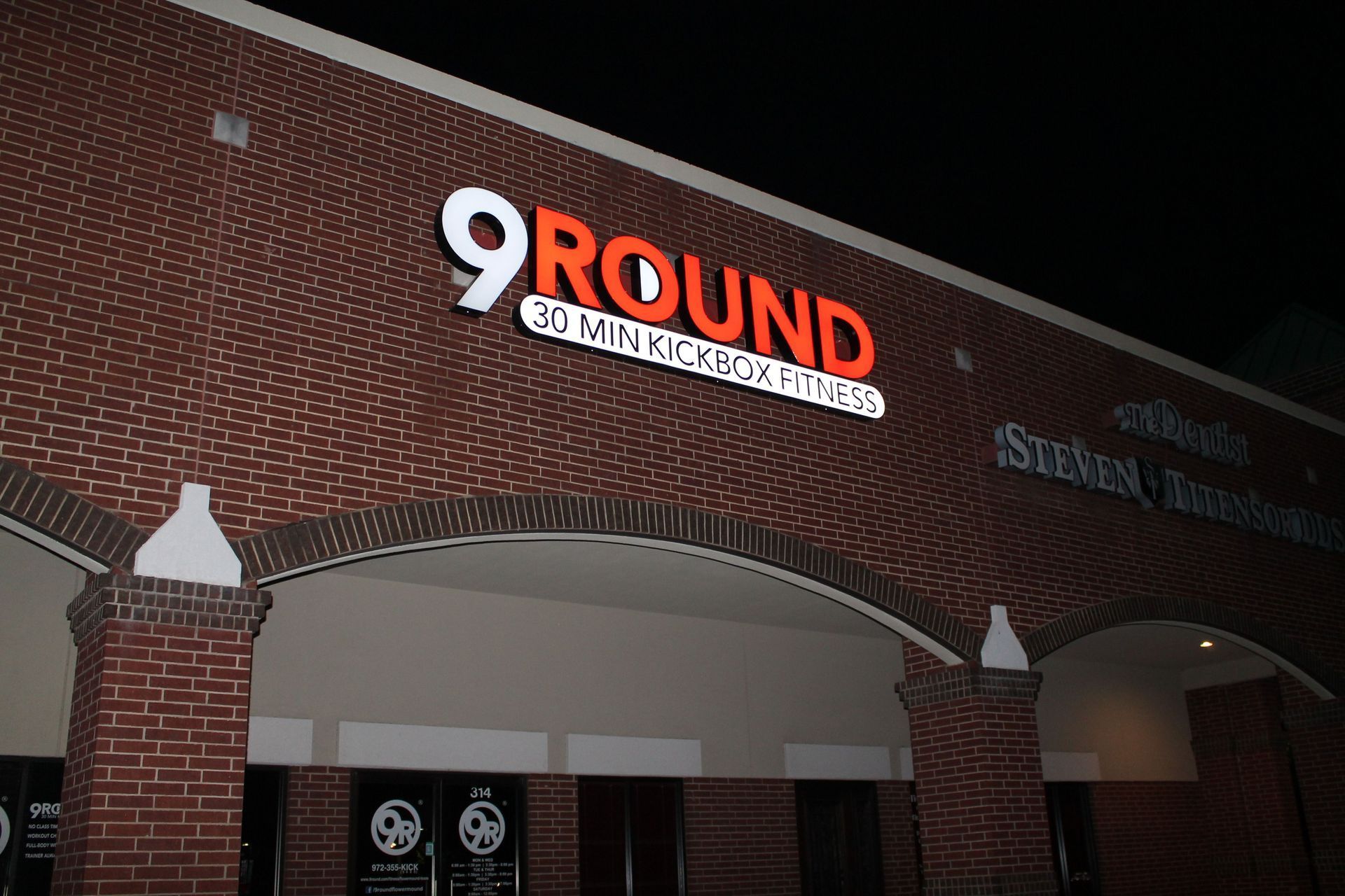 Illuminated channel letter storefront sign for 9Round Kickbox Fitness in Highland Village, TX.